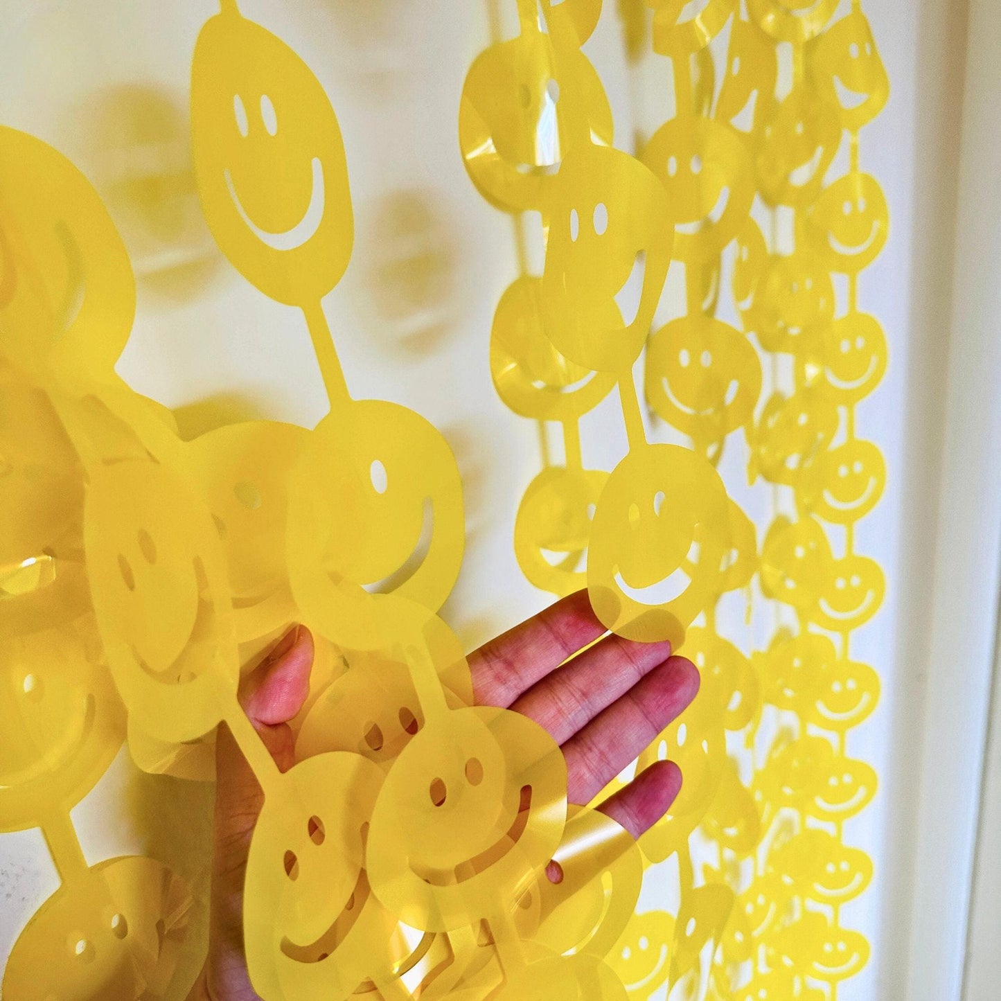 a person's hand is holding a bunch of yellow objects