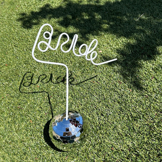 a golf ball and tee on the grass