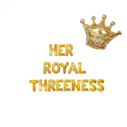 a gold foil crown with the words her royal threeness