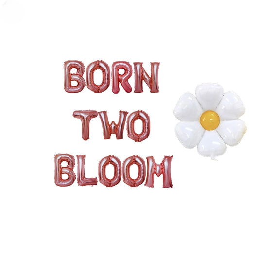 a white flower sitting next to the words born two bloom